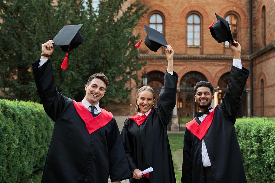 Students celebrating graduation with hats - Certificate photo created by artursafronovvvv - www.freepik.com